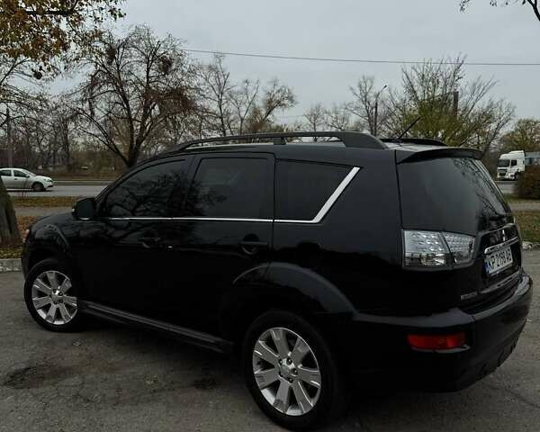 Черный Мицубиси Аутлендер ХЛ, объемом двигателя 2.18 л и пробегом 253 тыс. км за 12500 $, фото 6 на Automoto.ua