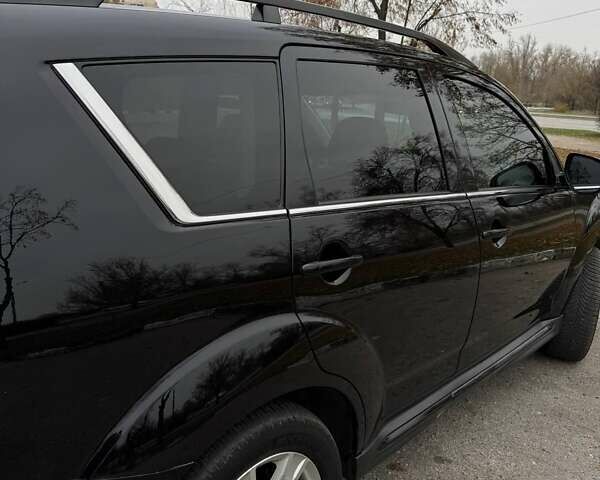 Черный Мицубиси Аутлендер ХЛ, объемом двигателя 2.18 л и пробегом 253 тыс. км за 12500 $, фото 7 на Automoto.ua