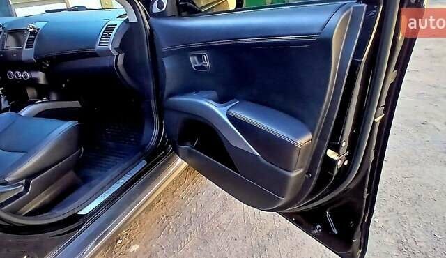 Черный Мицубиси Аутлендер ХЛ, объемом двигателя 2.3 л и пробегом 190 тыс. км за 12500 $, фото 14 на Automoto.ua