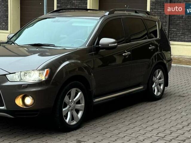 Коричневий Міцубісі Аутлендер ХЛ, об'ємом двигуна 2.36 л та пробігом 160 тис. км за 10900 $, фото 1 на Automoto.ua
