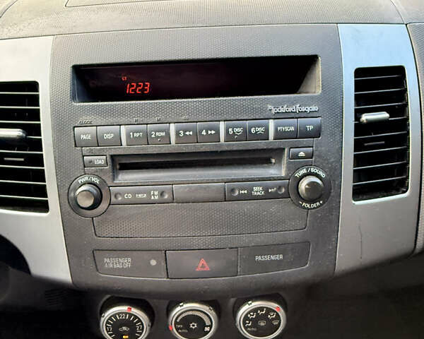 Мицубиси Аутлендер ХЛ 2008 в Киеве на Automoto.ua Красный Мицубиси Аутлендер ХЛ, объемом двигателя 2.4 л и пробегом 99 тыс. км за 11000 $, фото 11 на Automoto.ua