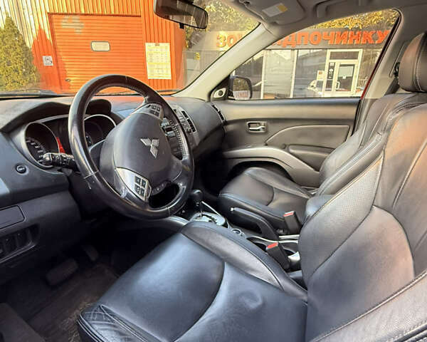 Мицубиси Аутлендер ХЛ 2008 в Киеве на Automoto.ua Красный Мицубиси Аутлендер ХЛ, объемом двигателя 2.4 л и пробегом 99 тыс. км за 11000 $, фото 14 на Automoto.ua