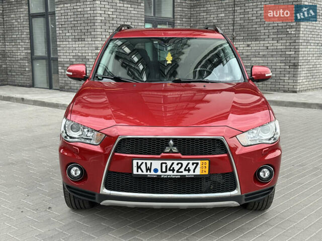 Красный Мицубиси Аутлендер ХЛ, объемом двигателя 2.2 л и пробегом 188 тыс. км за 10550 $, фото 1 на Automoto.ua