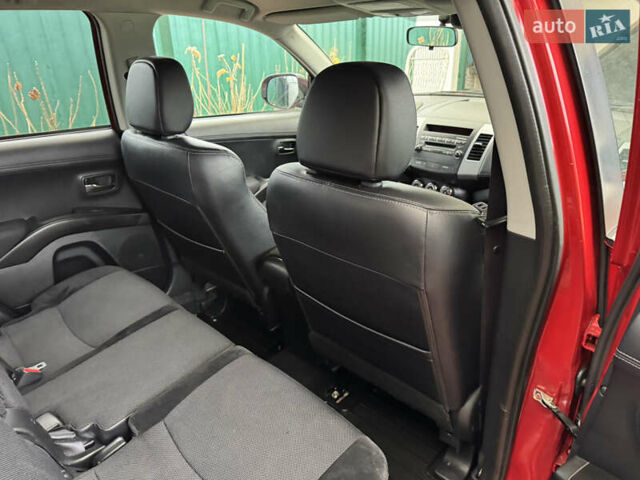 Красный Мицубиси Аутлендер ХЛ, объемом двигателя 2.2 л и пробегом 227 тыс. км за 11999 $, фото 46 на Automoto.ua