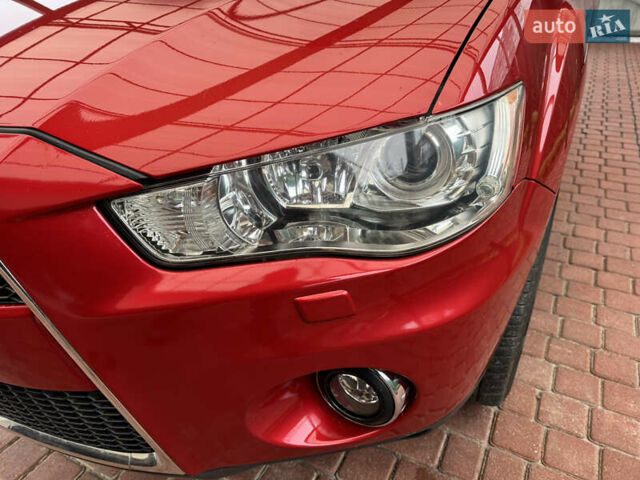 Красный Мицубиси Аутлендер ХЛ, объемом двигателя 2.2 л и пробегом 227 тыс. км за 11999 $, фото 10 на Automoto.ua