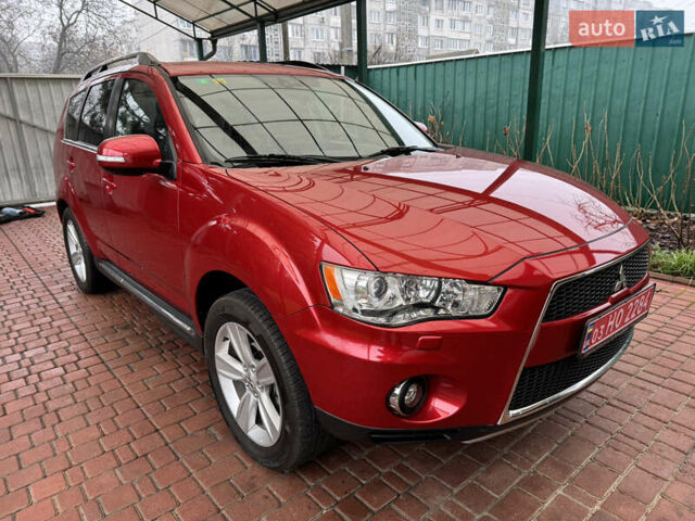 Красный Мицубиси Аутлендер ХЛ, объемом двигателя 2.2 л и пробегом 227 тыс. км за 11999 $, фото 7 на Automoto.ua