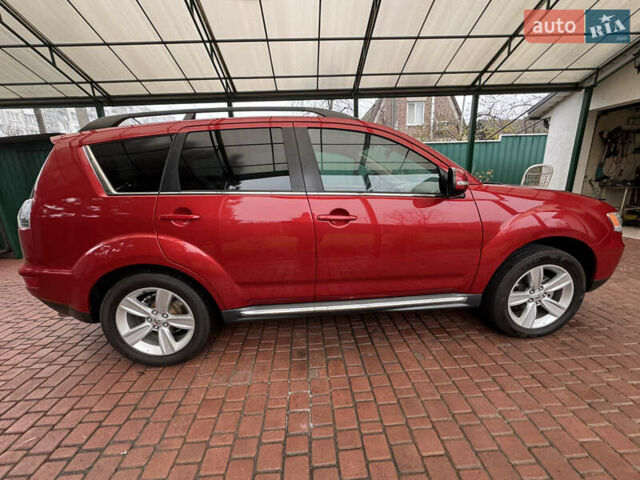 Красный Мицубиси Аутлендер ХЛ, объемом двигателя 2.2 л и пробегом 227 тыс. км за 11999 $, фото 6 на Automoto.ua