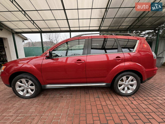 Красный Мицубиси Аутлендер ХЛ, объемом двигателя 2.2 л и пробегом 227 тыс. км за 11999 $, фото 2 на Automoto.ua