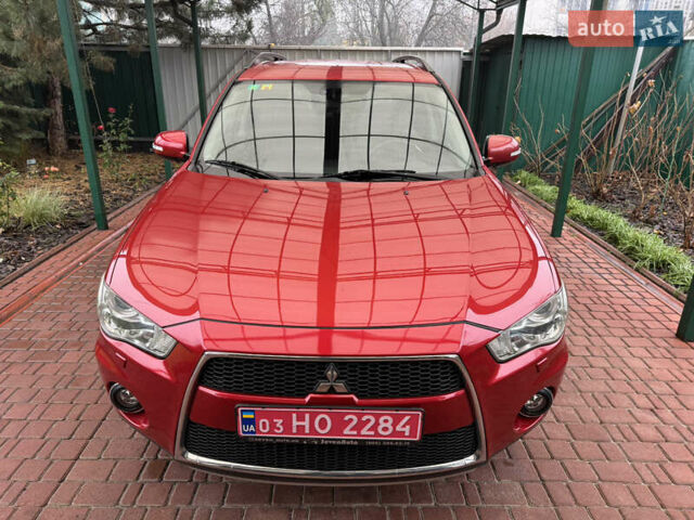 Красный Мицубиси Аутлендер ХЛ, объемом двигателя 2.2 л и пробегом 227 тыс. км за 11999 $, фото 8 на Automoto.ua