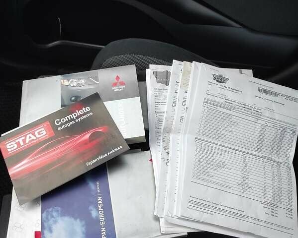 Сірий Міцубісі Аутлендер ХЛ, об'ємом двигуна 2.4 л та пробігом 307 тис. км за 8399 $, фото 76 на Automoto.ua