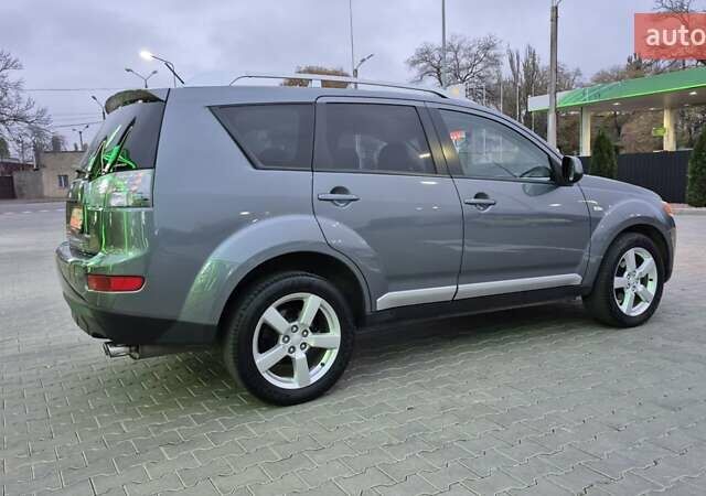 Серый Мицубиси Аутлендер ХЛ, объемом двигателя 2.2 л и пробегом 268 тыс. км за 8999 $, фото 3 на Automoto.ua