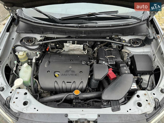 Серый Мицубиси Аутлендер ХЛ, объемом двигателя 2.4 л и пробегом 241 тыс. км за 7350 $, фото 11 на Automoto.ua