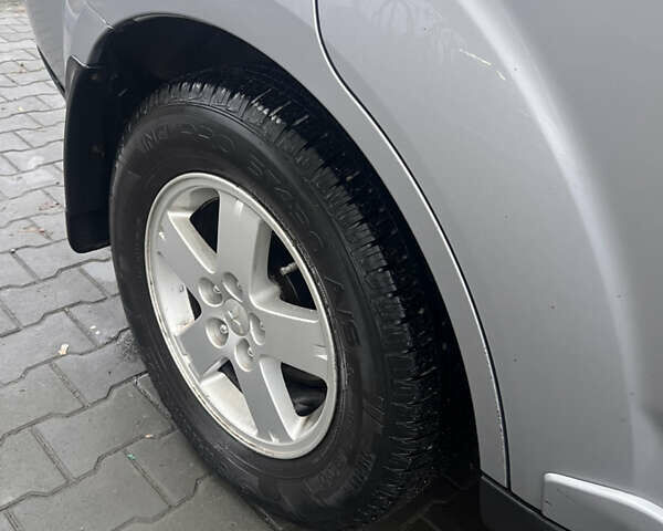 Серый Мицубиси Аутлендер ХЛ, объемом двигателя 2.36 л и пробегом 241 тыс. км за 8200 $, фото 6 на Automoto.ua