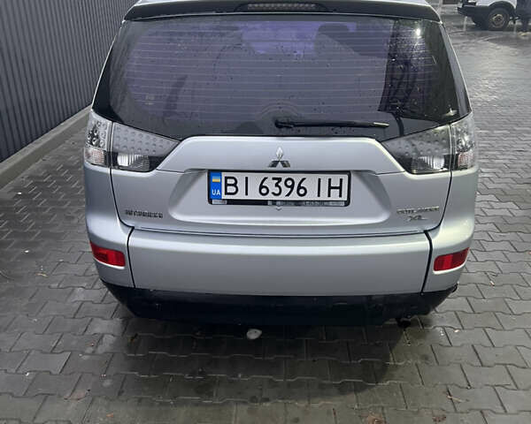 Серый Мицубиси Аутлендер ХЛ, объемом двигателя 2.36 л и пробегом 241 тыс. км за 8200 $, фото 5 на Automoto.ua
