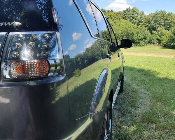 Серый Мицубиси Аутлендер ХЛ, объемом двигателя 2.36 л и пробегом 235 тыс. км за 10800 $, фото 2 на Automoto.ua