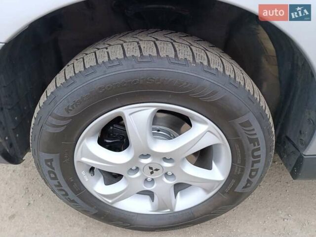 Серый Мицубиси Аутлендер ХЛ, объемом двигателя 2 л и пробегом 209 тыс. км за 9555 $, фото 44 на Automoto.ua
