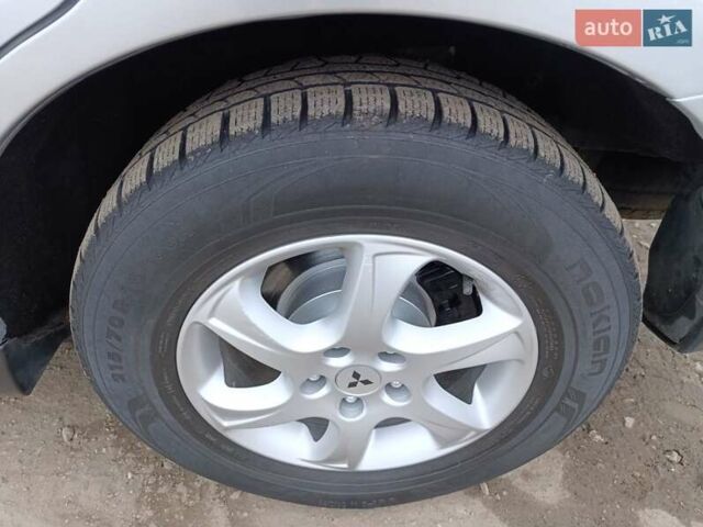 Серый Мицубиси Аутлендер ХЛ, объемом двигателя 2 л и пробегом 209 тыс. км за 9555 $, фото 45 на Automoto.ua