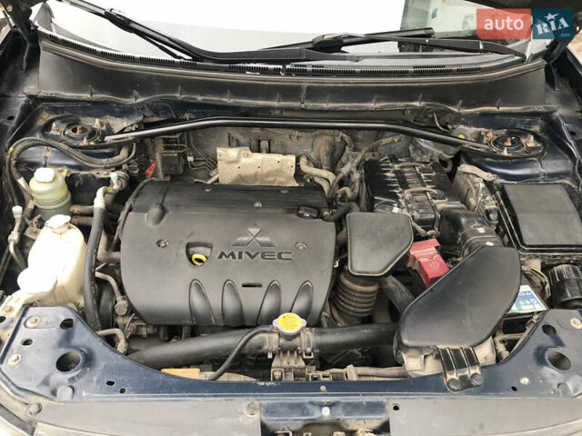 Синий Мицубиси Аутлендер ХЛ, объемом двигателя 2.4 л и пробегом 295 тыс. км за 7600 $, фото 6 на Automoto.ua