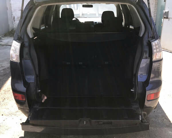 Синий Мицубиси Аутлендер ХЛ, объемом двигателя 2.4 л и пробегом 295 тыс. км за 7600 $, фото 10 на Automoto.ua