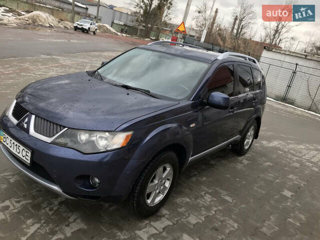 Синий Мицубиси Аутлендер ХЛ, объемом двигателя 2.4 л и пробегом 295 тыс. км за 7600 $, фото 1 на Automoto.ua
