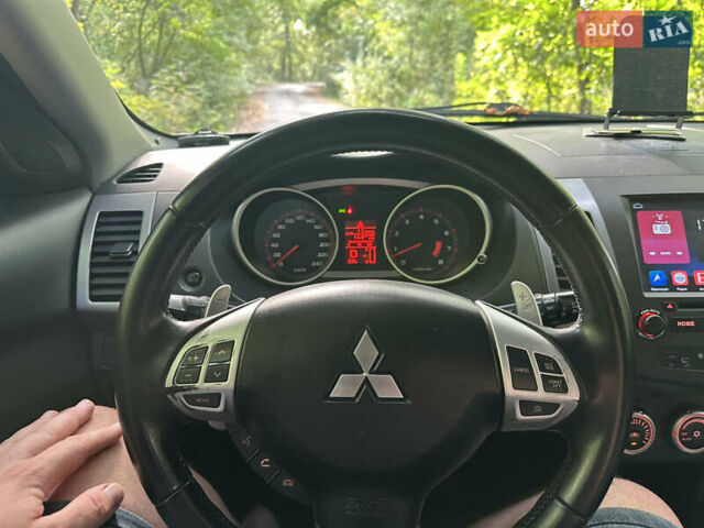 Синий Мицубиси Аутлендер ХЛ, объемом двигателя 2.4 л и пробегом 170 тыс. км за 7299 $, фото 22 на Automoto.ua