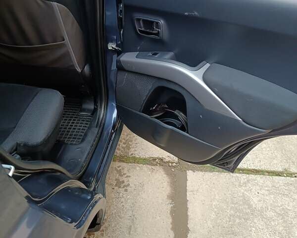 Синий Мицубиси Аутлендер ХЛ, объемом двигателя 2.4 л и пробегом 240 тыс. км за 8500 $, фото 9 на Automoto.ua