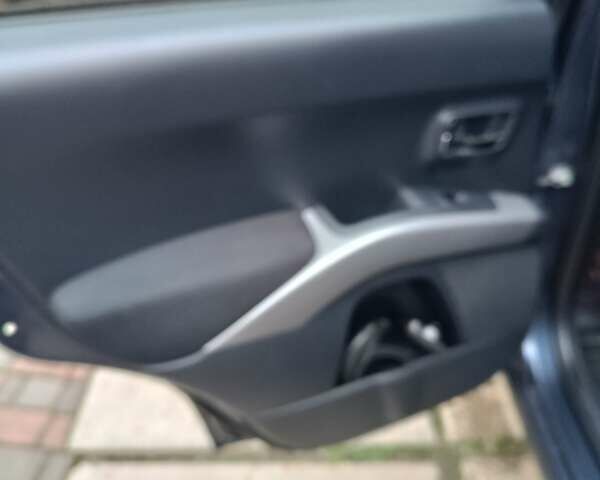 Синий Мицубиси Аутлендер ХЛ, объемом двигателя 2.4 л и пробегом 240 тыс. км за 8500 $, фото 13 на Automoto.ua