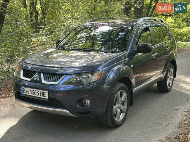 Синий Мицубиси Аутлендер ХЛ, объемом двигателя 2.4 л и пробегом 170 тыс. км за 7299 $, фото 3 на Automoto.ua