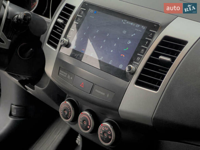 Синий Мицубиси Аутлендер ХЛ, объемом двигателя 2.4 л и пробегом 249 тыс. км за 8800 $, фото 20 на Automoto.ua