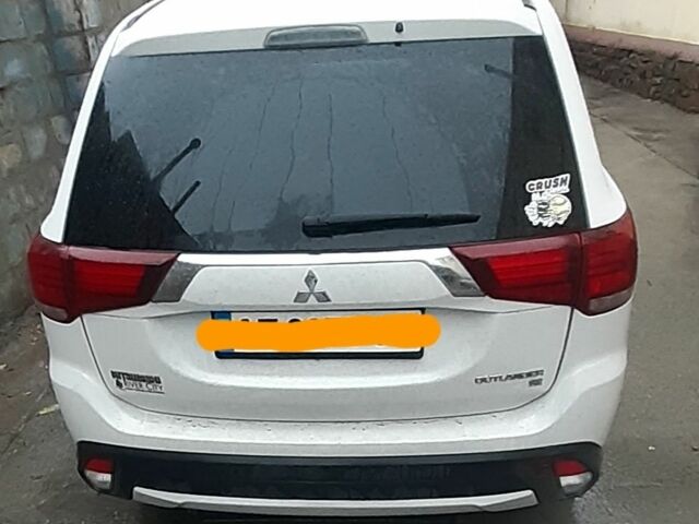 Білий Міцубісі Аутлендер, об'ємом двигуна 2.4 л та пробігом 158 тис. км за 15000 $, фото 1 на Automoto.ua