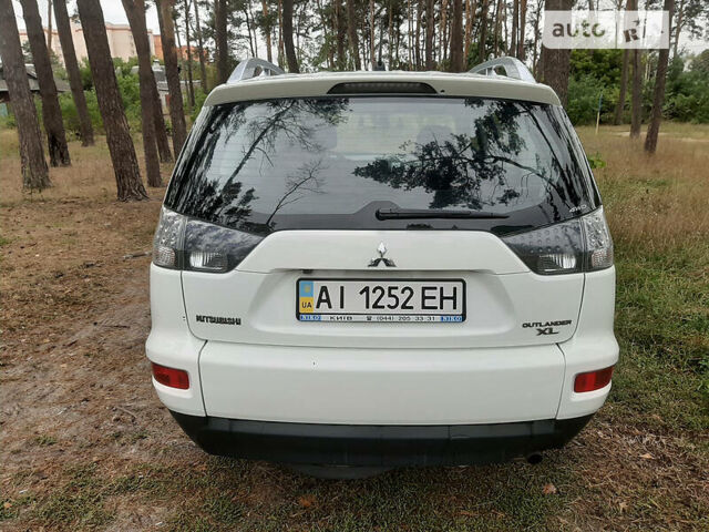Белый Мицубиси Аутлендер, объемом двигателя 2.4 л и пробегом 63 тыс. км за 13800 $, фото 1 на Automoto.ua