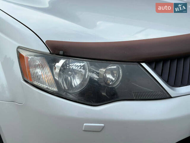 Белый Мицубиси Аутлендер, объемом двигателя 2.36 л и пробегом 160 тыс. км за 9299 $, фото 42 на Automoto.ua