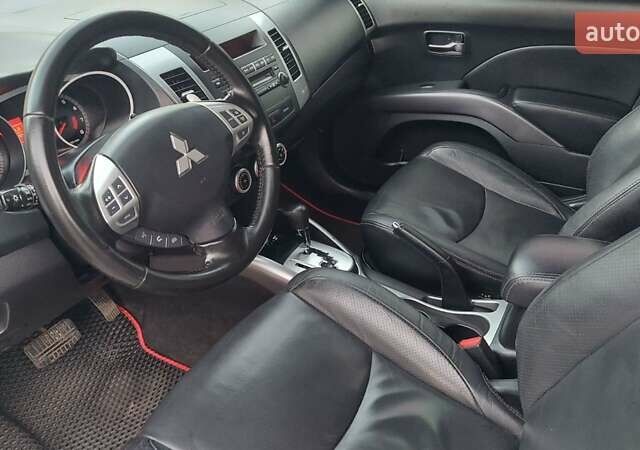 Белый Мицубиси Аутлендер, объемом двигателя 2.36 л и пробегом 185 тыс. км за 8950 $, фото 21 на Automoto.ua