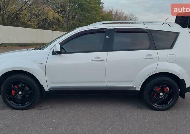 Белый Мицубиси Аутлендер, объемом двигателя 2.36 л и пробегом 185 тыс. км за 8950 $, фото 18 на Automoto.ua