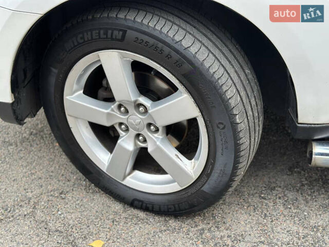 Белый Мицубиси Аутлендер, объемом двигателя 2.36 л и пробегом 160 тыс. км за 9299 $, фото 41 на Automoto.ua
