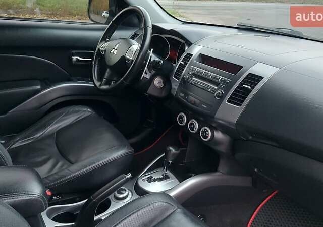 Белый Мицубиси Аутлендер, объемом двигателя 2.36 л и пробегом 185 тыс. км за 8950 $, фото 27 на Automoto.ua