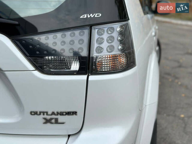 Белый Мицубиси Аутлендер, объемом двигателя 2.36 л и пробегом 160 тыс. км за 9299 $, фото 44 на Automoto.ua