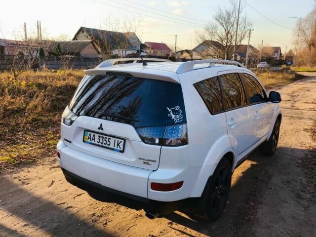 Белый Мицубиси Аутлендер, объемом двигателя 2.4 л и пробегом 149 тыс. км за 9000 $, фото 2 на Automoto.ua