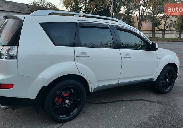 Белый Мицубиси Аутлендер, объемом двигателя 2.36 л и пробегом 185 тыс. км за 8950 $, фото 10 на Automoto.ua