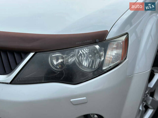 Белый Мицубиси Аутлендер, объемом двигателя 2.36 л и пробегом 160 тыс. км за 9299 $, фото 43 на Automoto.ua