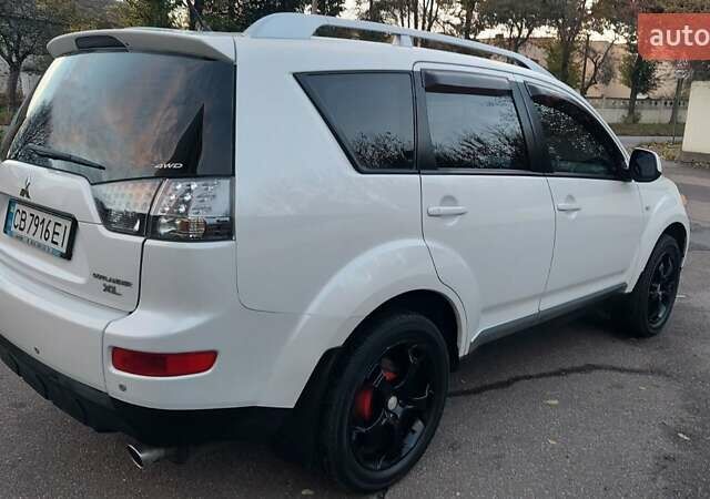 Белый Мицубиси Аутлендер, объемом двигателя 2.36 л и пробегом 185 тыс. км за 8950 $, фото 12 на Automoto.ua