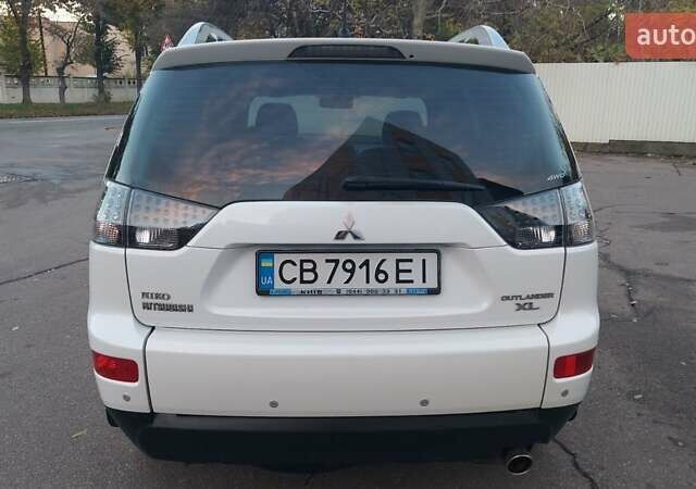Белый Мицубиси Аутлендер, объемом двигателя 2.36 л и пробегом 185 тыс. км за 8950 $, фото 14 на Automoto.ua