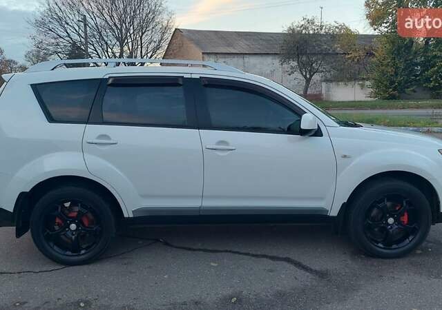 Белый Мицубиси Аутлендер, объемом двигателя 2.36 л и пробегом 185 тыс. км за 8950 $, фото 8 на Automoto.ua