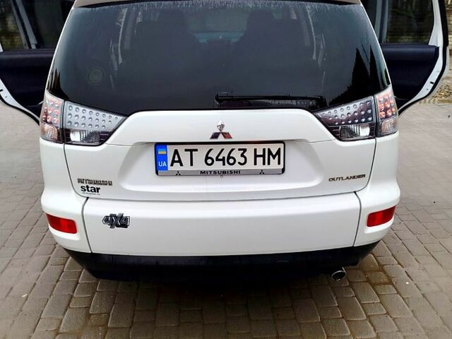 Белый Мицубиси Аутлендер, объемом двигателя 2.4 л и пробегом 283 тыс. км за 11000 $, фото 2 на Automoto.ua