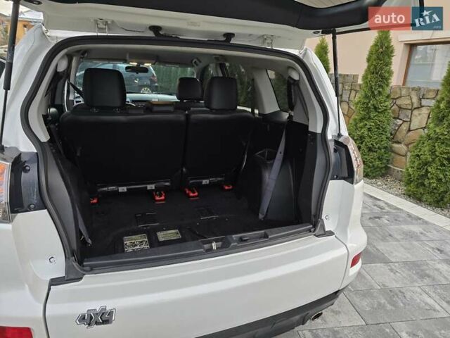 Білий Міцубісі Аутлендер, об'ємом двигуна 2.36 л та пробігом 178 тис. км за 10200 $, фото 32 на Automoto.ua