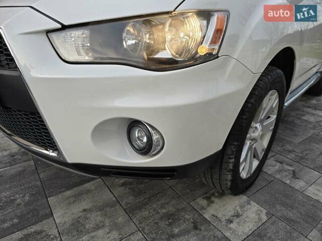 Білий Міцубісі Аутлендер, об'ємом двигуна 2.36 л та пробігом 178 тис. км за 10200 $, фото 45 на Automoto.ua