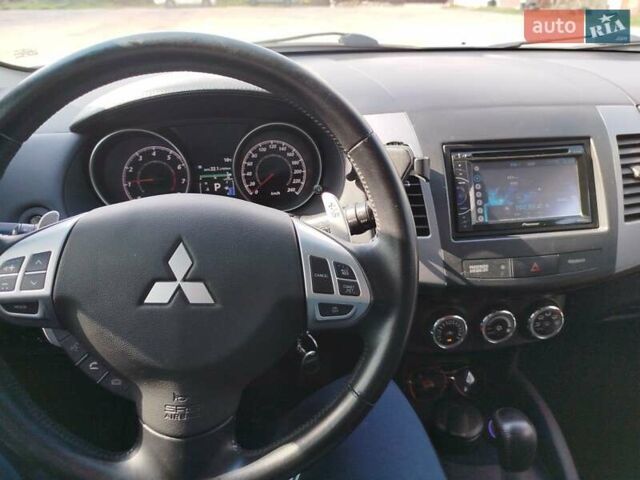 Белый Мицубиси Аутлендер, объемом двигателя 2.4 л и пробегом 157 тыс. км за 11000 $, фото 26 на Automoto.ua