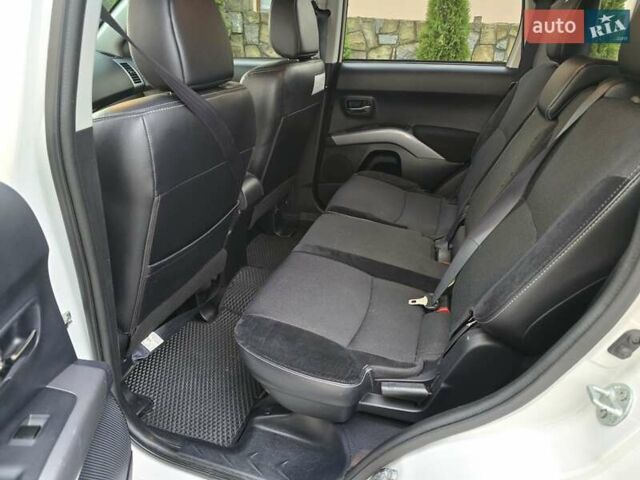 Білий Міцубісі Аутлендер, об'ємом двигуна 2.36 л та пробігом 178 тис. км за 10200 $, фото 26 на Automoto.ua