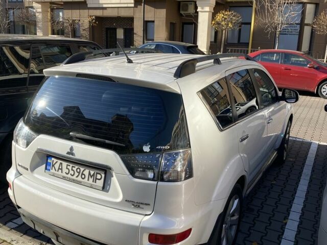 Белый Мицубиси Аутлендер, объемом двигателя 2.4 л и пробегом 154 тыс. км за 12500 $, фото 4 на Automoto.ua