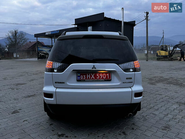 Белый Мицубиси Аутлендер, объемом двигателя 2.3 л и пробегом 161 тыс. км за 11150 $, фото 19 на Automoto.ua